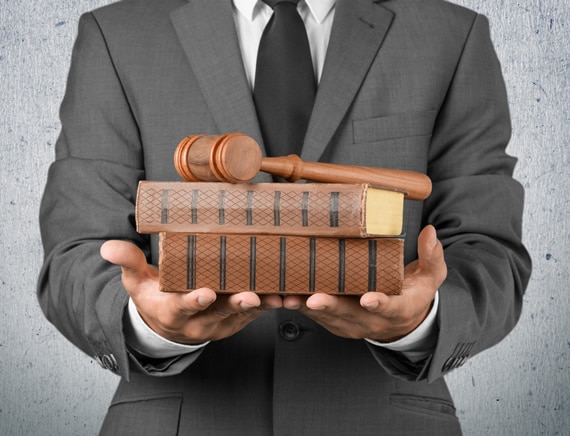 Lawyer holding books and gavel
